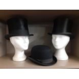 A Henry Heath black silk top hat, 21" circumference, a Chasseriaux black operatic hat, 21"