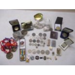 A mixed lot of coins, medal, badges, lighter and other items to include a George IV silver shilling,
