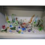 A collection of glass birds, ducks, horses, an elephant and other animals to include an Archimede