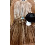 Two mid 20th Century light brown mink jackets together with a Russian black rabbit fur