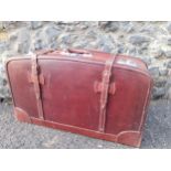 A good quality brown leather suitcase with key and blue silk lining, 70cm x41cm Location: BWR