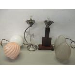 Two Art Deco style table lamps, together with four glass shades