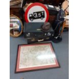 A vintage lot comprising two suitcases, a Dunn & Co brown felt hat, a circular metal road sign, a