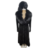 An Alan Fischelis black shearling and rabbit hair three-quarter length coat, UK size 10/12 having an