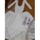 A WW1 nurse's partial uniform comprising 2 white starched aprons, one with pockets, collars and