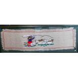A framed Peruvian embroidered panel depicting a shepherdess and her sheep carrying an infant on