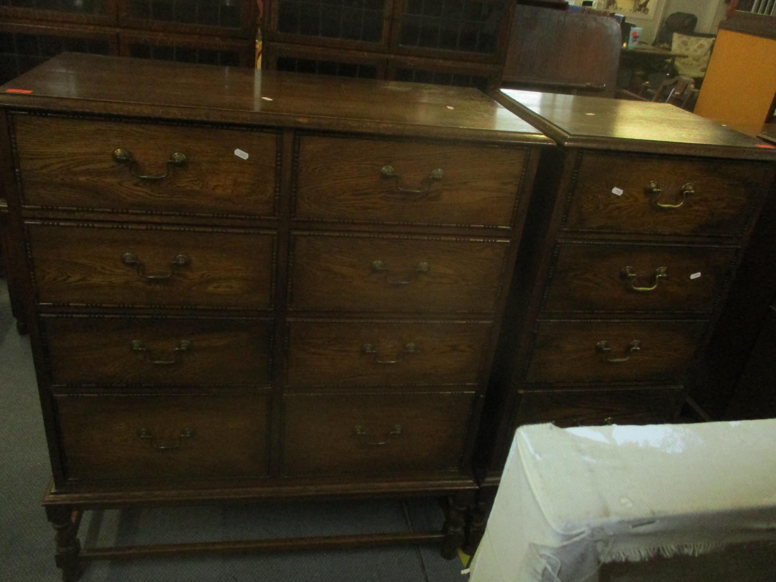 An early 20th century oak side chest of eight short drawers with brass swan neck handles, sausage - Image 2 of 5