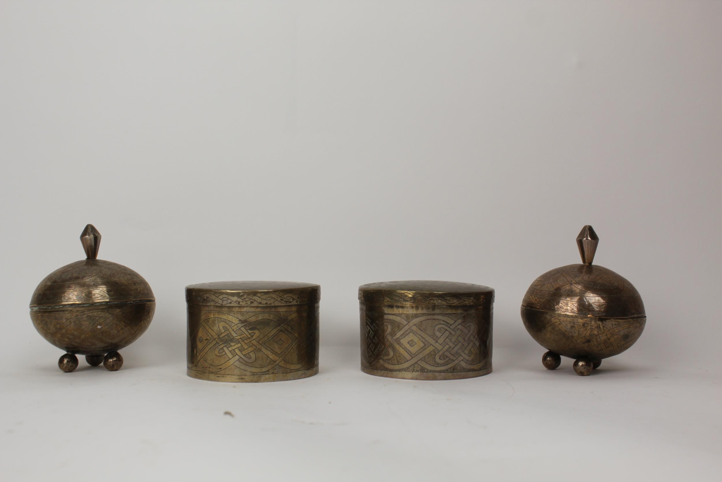 African silver coloured metal comprising a pair of cylindrical pots and covers, inscribed Aikin
