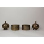 African silver coloured metal comprising a pair of cylindrical pots and covers, inscribed Aikin