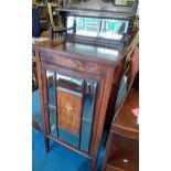 A late Victorian rosewood music cabinet with a raised mirrored back and door Location: RAF