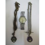 A Smith wristwatch, a silver watch chain and another watch chain Location: