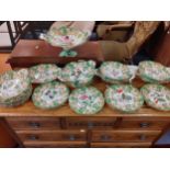 A 19th Century dessert service A/F having a white ground with hand-painted wild flowers surrounded