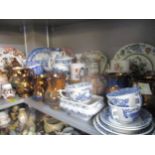 A quantity of 19th century and later ceramics to include a collection of copper lustre jugs, blue