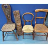 A late 19th/early 20th century oak carved spinning chair together with a 19th century oak carved