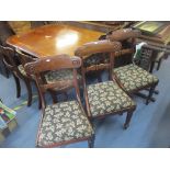 A William IV mahogany breakfast table with tilt top over a rectangular column, on scrolled,