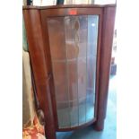 A mid 20th century walnut display cabinet with glazed door, leaded with three teardrop yellow