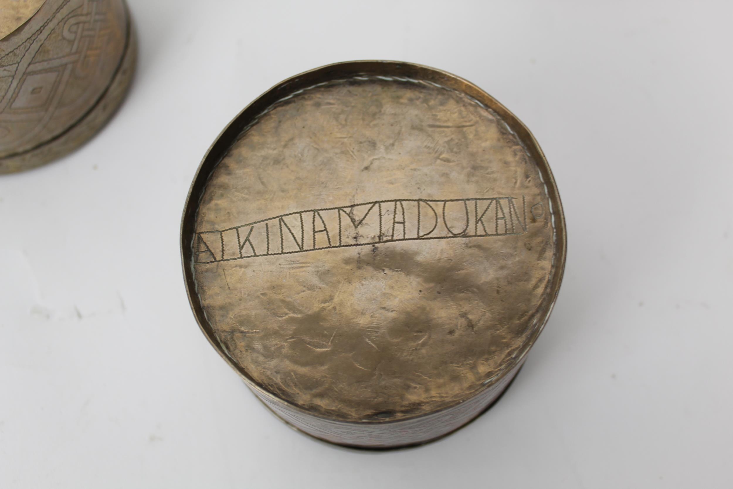 African silver coloured metal comprising a pair of cylindrical pots and covers, inscribed Aikin - Image 3 of 3