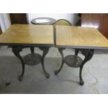 Two cast iron and wooden topped pub tables, 71cm high Location: