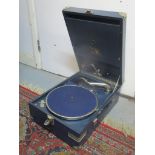 An HMV table top gramophone in a blue case Location: