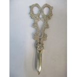 A pair of silver grape scissors Location: