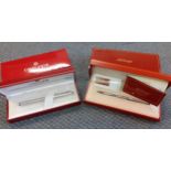 A Caran d'Ache silver coloured rhodium fountain pen and box together with a Dupont silver coloured