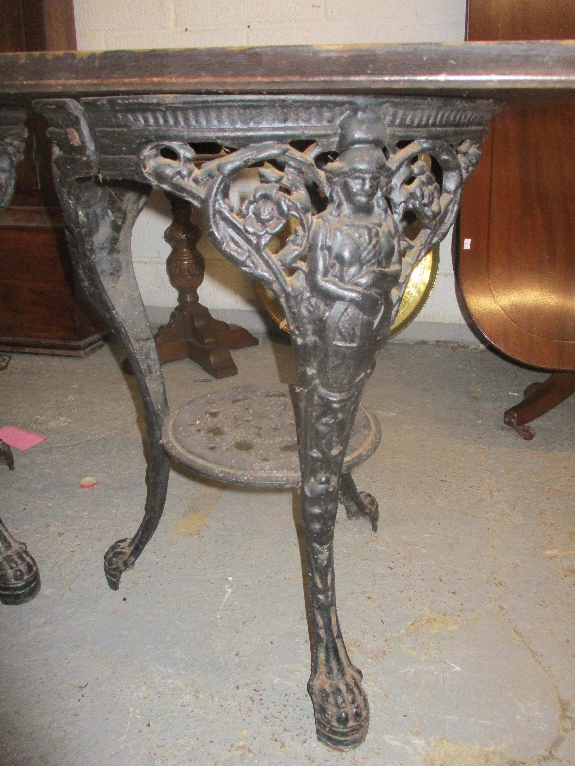 Two cast iron and wooden topped pub tables, 71cm high Location: - Image 2 of 3