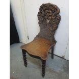A Victorian hall chair, the back carved with the Green Man, on barley twist front legs Location: