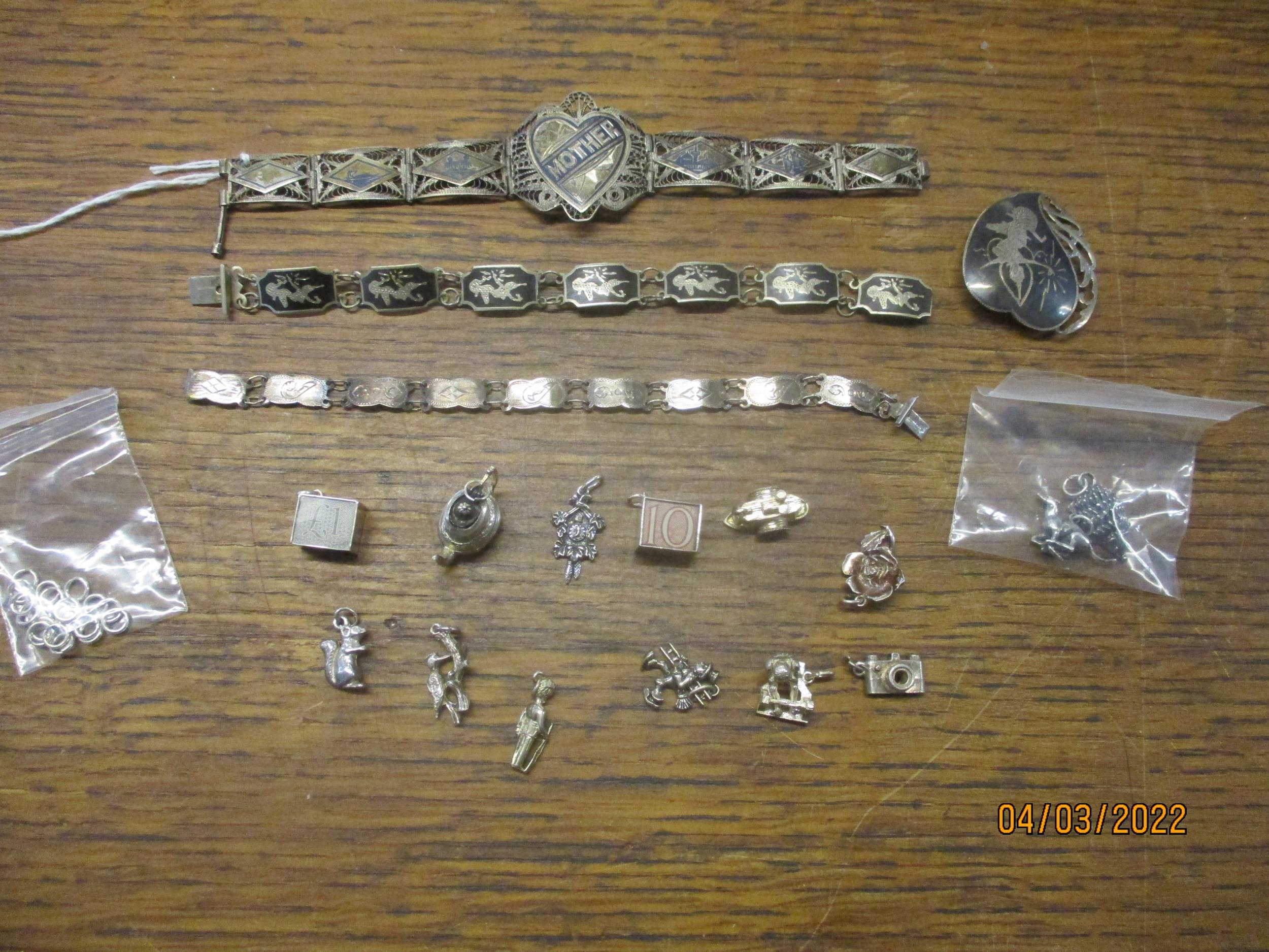 A selection of silver jewellery to include a Victorian/Edwardian bracelet decorated with panels of