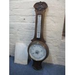 An early 20th century oak carved Aneroid barometer Location: