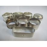 Eight silver napkin rings, some with engraved ornament, 207.7g Location: