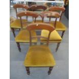 A set of six Victorian mahogany bar back dining chairs with upholstered seats on turned front and