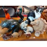 A Goebel model of a cat, 28cm high, a Mexican pottery bull and other ornaments Location: A1F