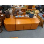 A Uldum Danish teak modular sideboard comprising of a central section with twin doors and four