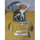 A mixed lot to include a mother of pearl and white metal letter opener, button hooks and other items