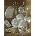 A mixed lot of silver plate to include sauce boats, sugar tongs, pierced basket, grape scissors