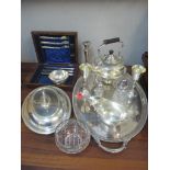 Silver plate to include an oval, twin handled tray, an entrée dish, a sauce boat, a spirit kettle