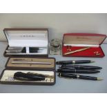 Pens to include a Cross ballpoint and propelling pencil set, a Montblanc pen inscribed European Bank