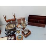 A vintage brown leather suitcase and contents to include grapefruit spoons, treen boxes and