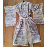 A 1930's/1940's Japanese silk kimono in pale lilac with Batik images of honeysuckles and leaves,