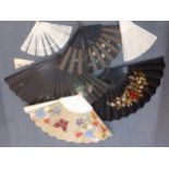 Seven late 19th/early 20th Century fans, 3 hand-painted and one embroidered together with one fan