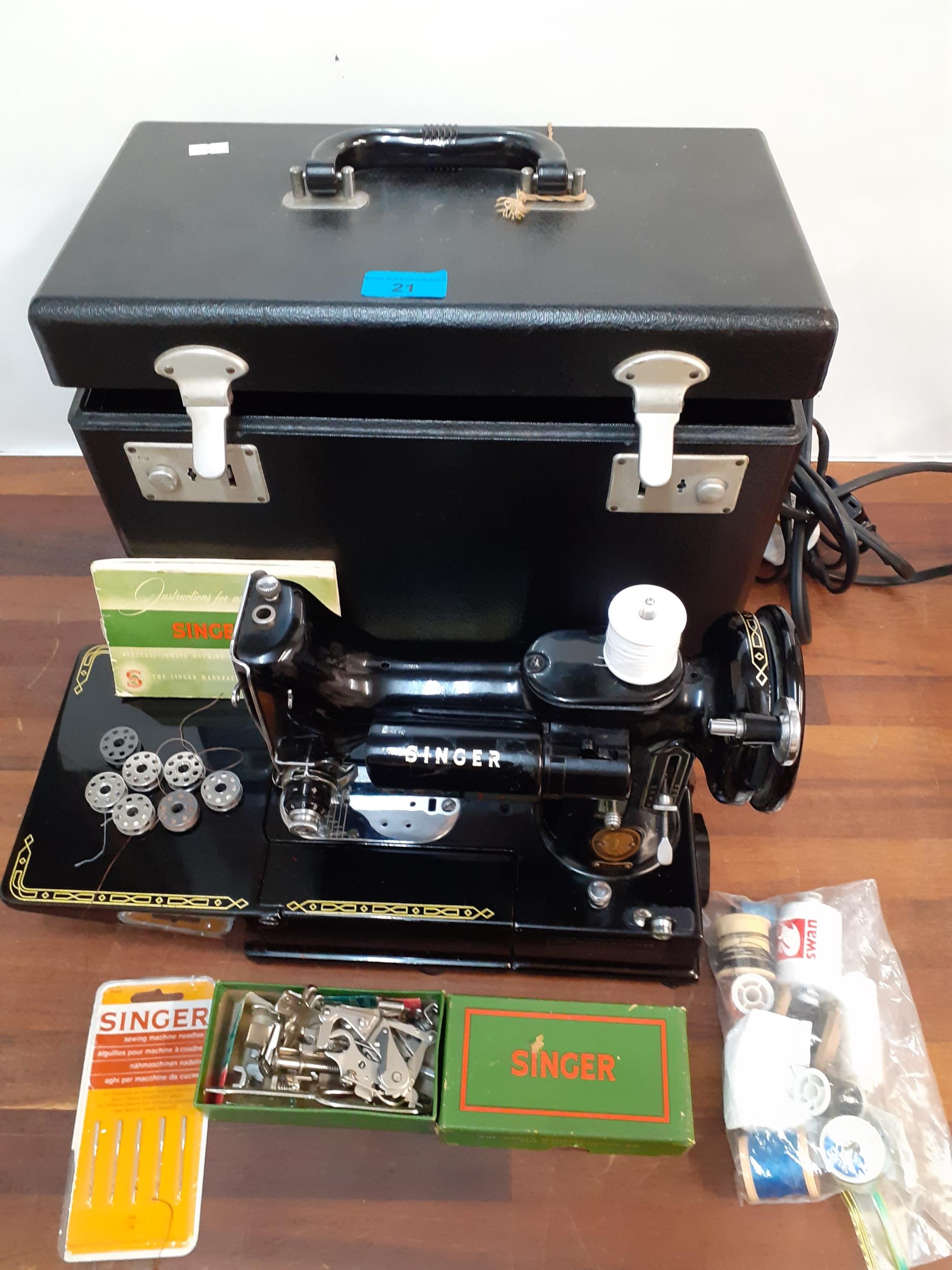 A Singer 222K featherweight free arm sewing machine in original case with accessories, circa 1950's