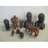 A quantity of mid to late 20th century African treen to include elephants and busts