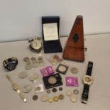 A mixed lot of coins and watches to include an 1825 George IV Shilling, a 1937 crown and others to