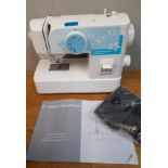 A modern and hardly used Frister+Rossmann 'Frister 5' electric sewing machine in travel case with