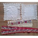 Two early 20th Century French white silk handkerchiefs with applique surround together with 2