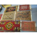 Six mixed rugs to include a Middle Eastern red ground prayer rug, 68 x 50
