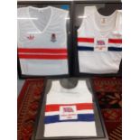 Three 1980's framed British Athletics vests (frames A/F) together with a GB cycling all in one and
