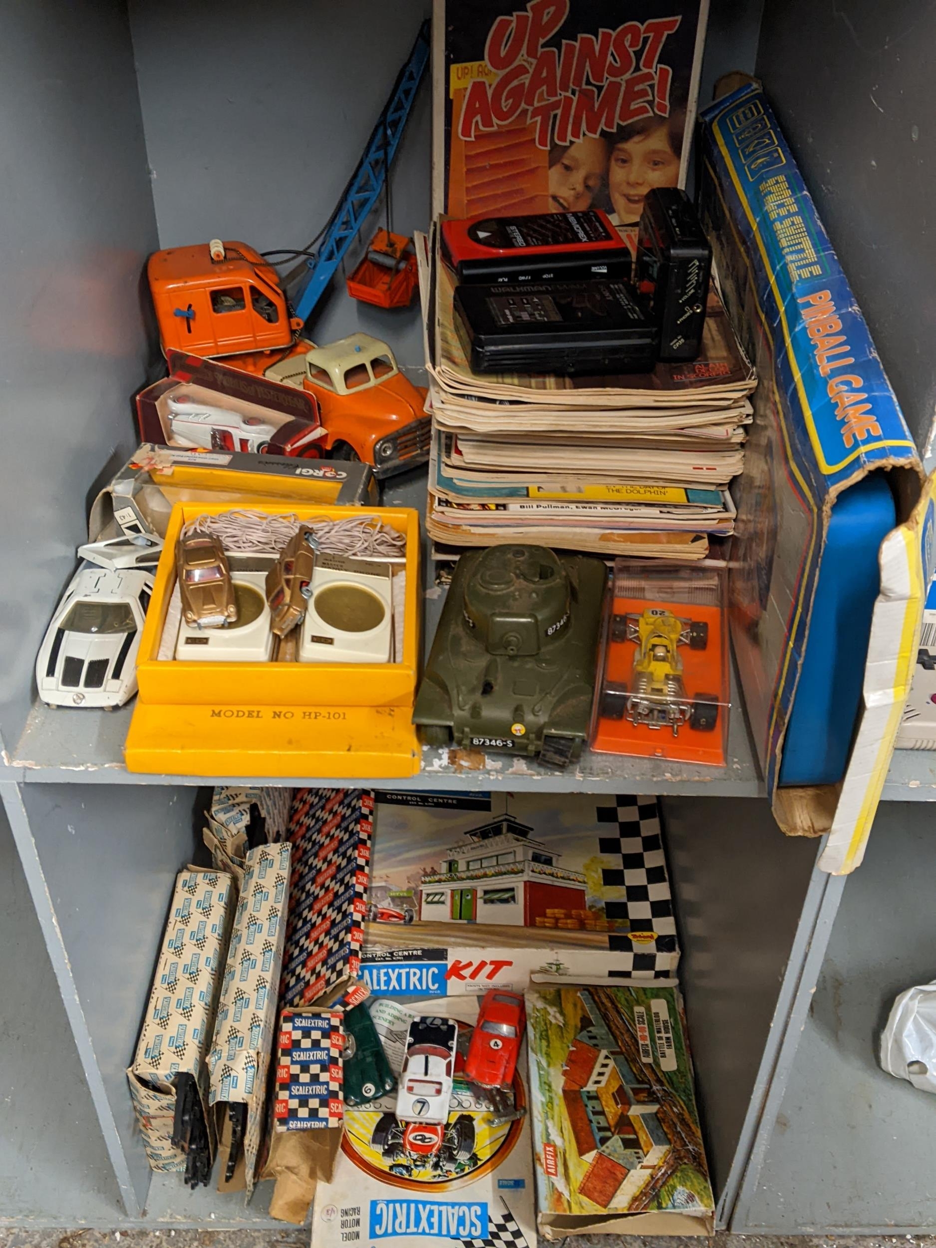 Vintage games to include Up Against Time, model cars, annuals, magazines, a Walkman and others along