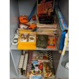 Vintage games to include Up Against Time, model cars, annuals, magazines, a Walkman and others along