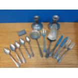 Mixed silver and silver plate to include a pair of silver candlesticks and a silver case Location: